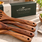 Close-up of acacia wood utensil handles engraved with the Wynden Home logo